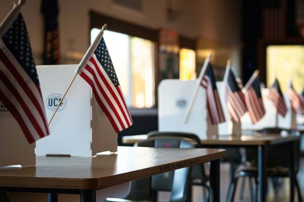 Interior of an empty polling place in the USA. . Elections in the USA and democracy concept, ai; generative; usa; america; election; day; president; flag; polling; place; empty; table; chair; interior; office; room; desk; chairs; conference; meeting; house;